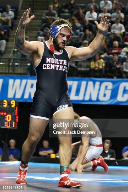 Cody Baldridge of North Central College celebrates a championship win against Jack Held of Wabash College in the 197 lb weight class during the...