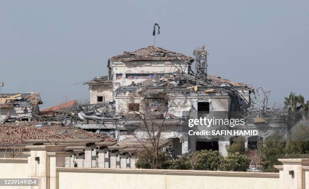 Picture taken on March 13 shows a view of a damaged building after an overnight attack in Arbil, the capital of the northern Iraqi Kurdish autonomous...