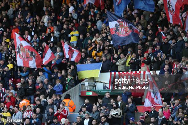 Sunderland fans display the Ukraine flag during the Sky Bet League 1 match between Sunderland and Crewe Alexandra at the Stadium Of Light, Sunderland...