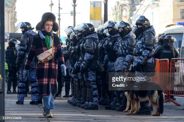 Riot police officers are seen deployed in the streets during a protest against Russian military action in Ukraine, in central Saint Petersburg on...