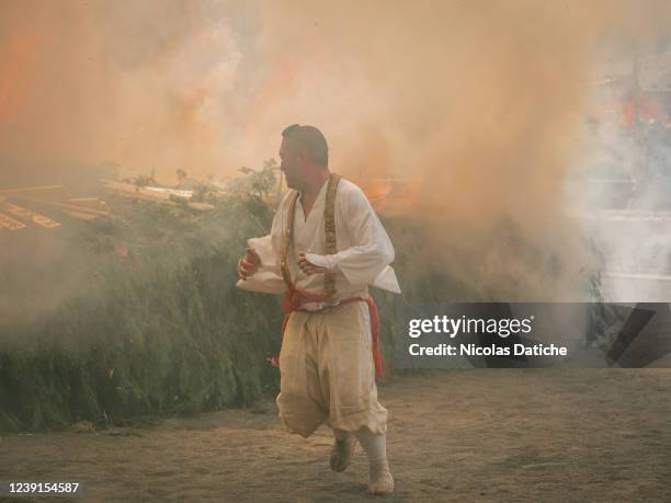 Yamabushi runs away from the bonfire during the fire-walking festival, called Hiwatari Matsuri in Japanese, at Mt. Takao. About 1,500 Japanese...