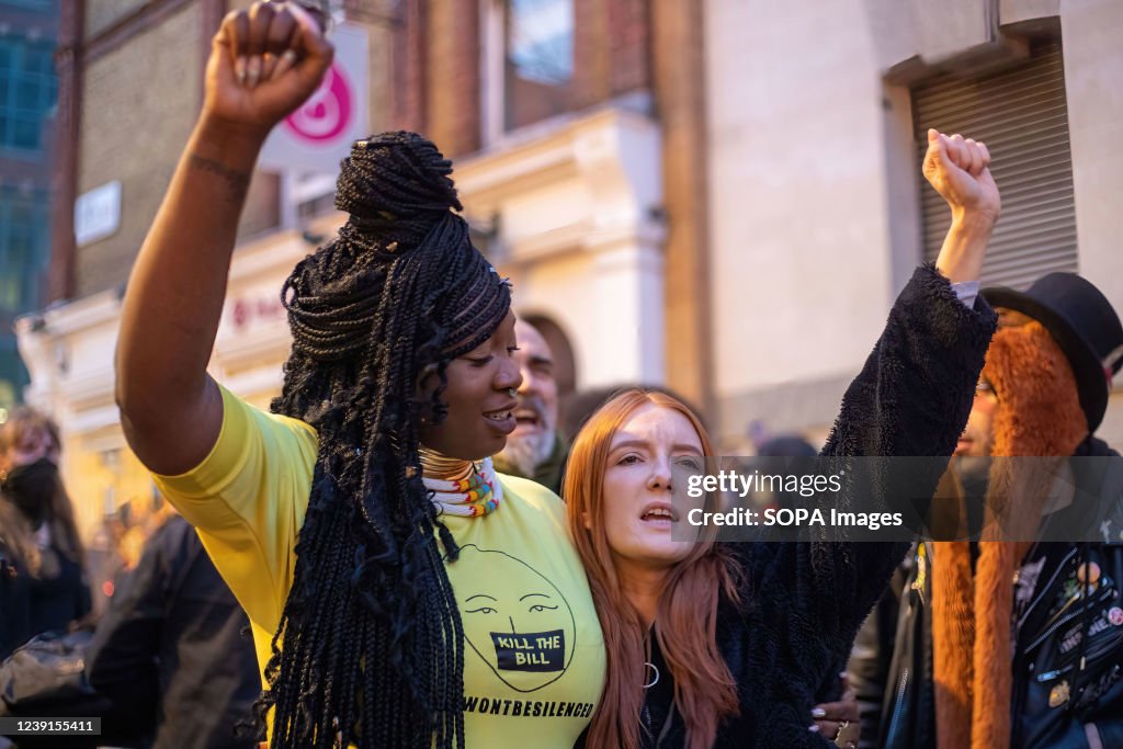 Patsy Stevenson (R) raises her fist during the demonstration...