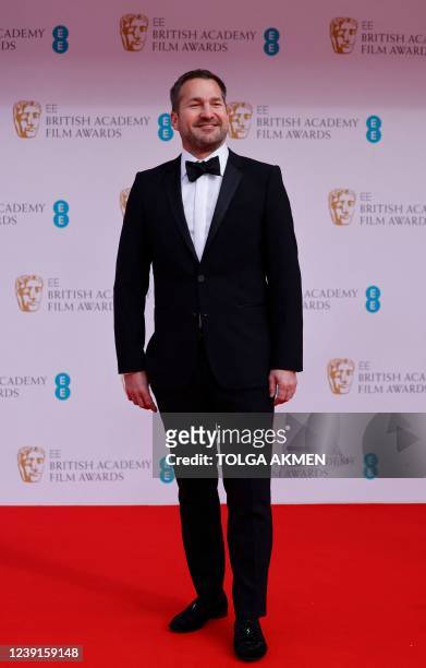 Special effects artist J.D Schwalm poses on the red carpet upon arrival at the BAFTA British Academy Film Awards at the Royal Albert Hall, in London,...