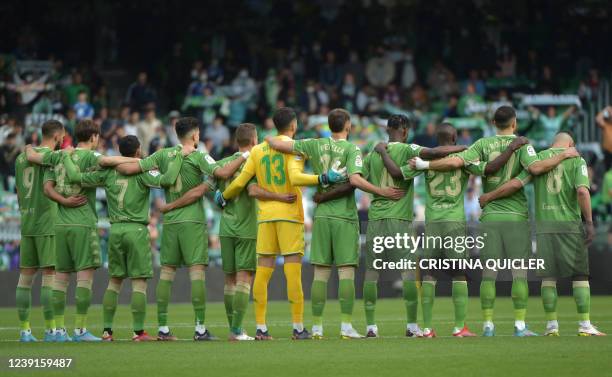 Real Betis' players pose for a minute of silence in tribute to late former manager of Real Betis Balompie Jose Maria Tejada prior to the Spanish...