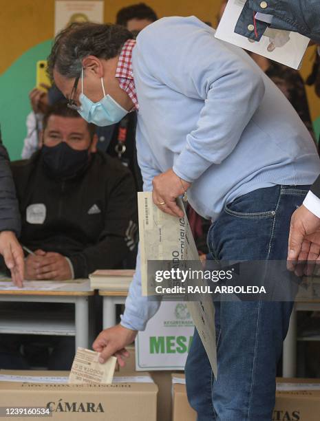 Colombian presidential pre-candidate for the 'Colombia Humana' political party and Historic Pact Coalition, Gustavo Petro, casts his vote at a...