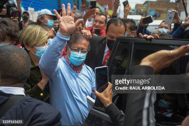 Colombian presidential pre-candidate for the 'Colombia Humana' political party and Historic Pact Coalition, Gustavo Petro, waves as he leaves a...