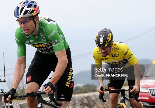 Jumbo-Visma's Belgian rider and best sprinter's green jersey Wout Van Aert and Jumbo-Visma's Slovenian rider and overall leader's yellow jersey...