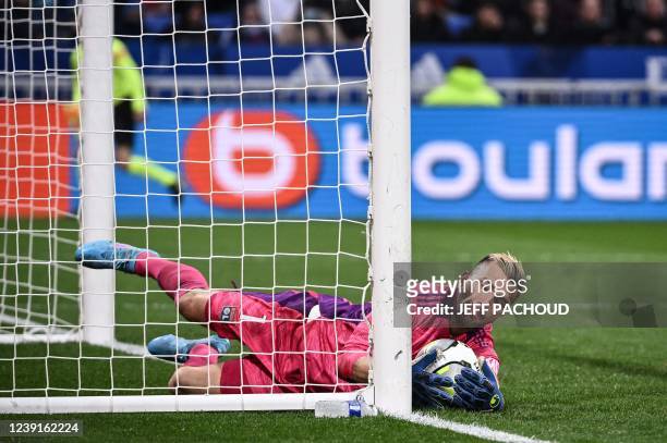 Lyon's Portuguese goalkeeper Anthony Lopes makes a safe during the French L1 football match between Lyon and Rennes at the Groupama stadium in...