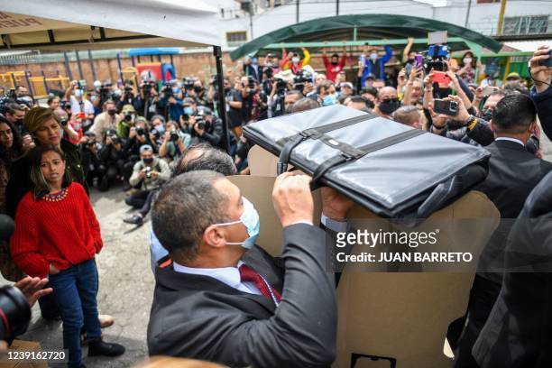 Bodyguards protect Colombian presidential pre-candidate for the 'Colombia Humana' political party and Historic Pact Coalition, Gustavo Petro, as he...