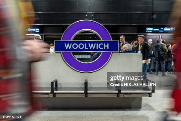 Volunteer 'passengers' wait on a platform during a test run of a Transport for London Elizabeth Line train between Paddington station and Woolwich...