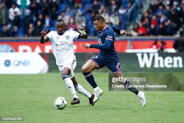 Kylian Mbappe of Paris Saint-Germain controls the ball against Alberth Elis of FC Girondins de Bordeaux during the Ligue 1 Uber Eats match between...