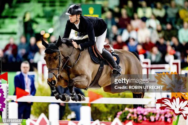 Swiss rider Steve Guerdat competes during the Jump-Off at the Rolex Grand Slam Grand Prix at the Brabanthallen in 's Hertogenbosch on March 13, 2022....