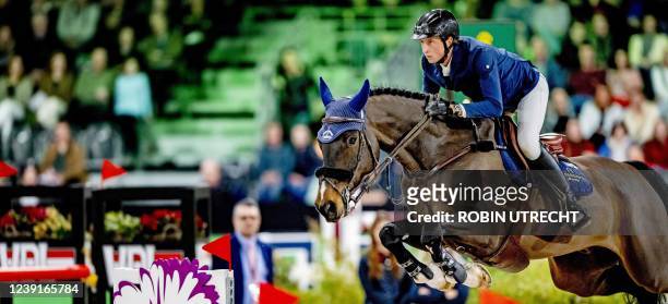 Swiss rider Martin Fuchs competes during the Jump-Off at the Rolex Grand Slam Grand Prix at the Brabanthallen in 's Hertogenbosch on March 13, 2022....