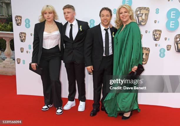 Stephen Graham and Hannah Walters pose with children at the EE British Academy Film Awards 2022 at Royal Albert Hall on March 13, 2022 in London,...