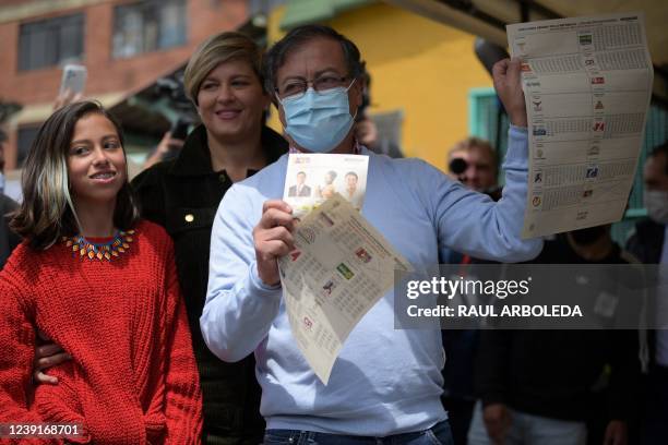 Colombian presidential pre-candidate for the 'Colombia Humana' political party and Historic Pact Coalition, Gustavo Petro, votes at a polling station...