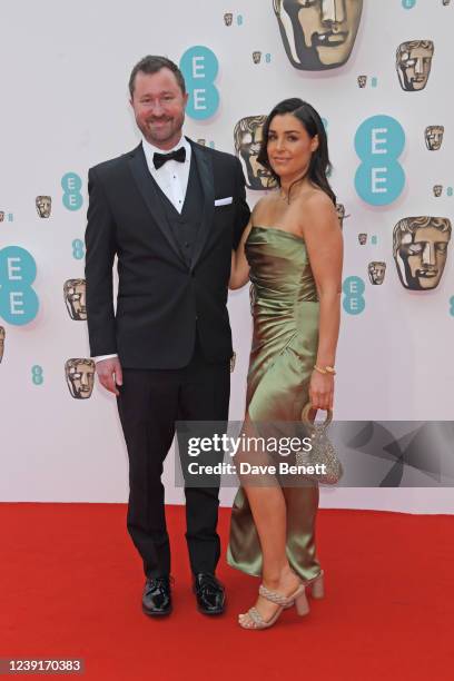 Erik Aadahl and guest attend the EE British Academy Film Awards 2022 at Royal Albert Hall on March 13, 2022 in London, England.