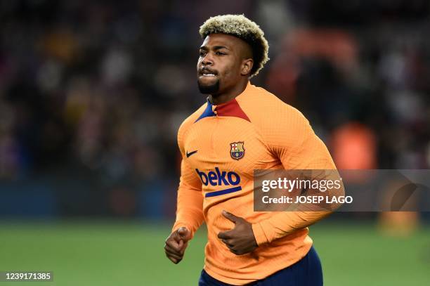 Barcelona's Spanish forward Adama Traore warms up prior to the Spanish league football match between FC Barcelona and CA Osasuna at the Camp Nou...
