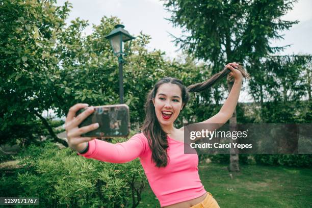 cool teenager taking selfies outdoors - girl selfie stock pictures, royalty-free photos & images