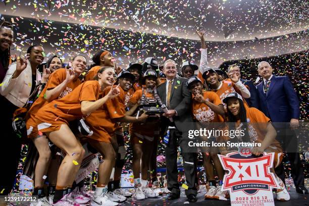 The Texas Womens Basketball team celebrate with the Championship trophy after their victory over the Baylor Bears during the Big12 Womens...