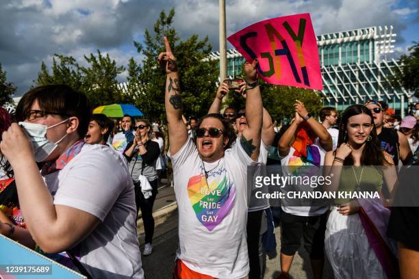 Members and supporters of the LGBTQ community attend the "Say Gay Anyway" rally in Miami Beach, Florida on March 13, 2022. - Florida's state senate...