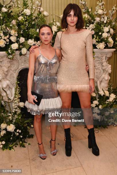 Bel Powley and Emma Appleton attend the British Vogue and Tiffany & Co. Fashion and Film Party 2022 at Annabel's on March 13, 2022 in London, England.