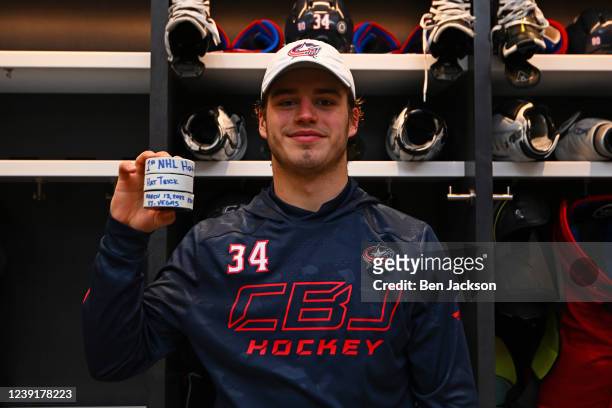 Cole Sillinger of the Columbus Blue Jackets poses with his pucks after scoring his first career hat trick in a game against the Vegas Golden Knights...