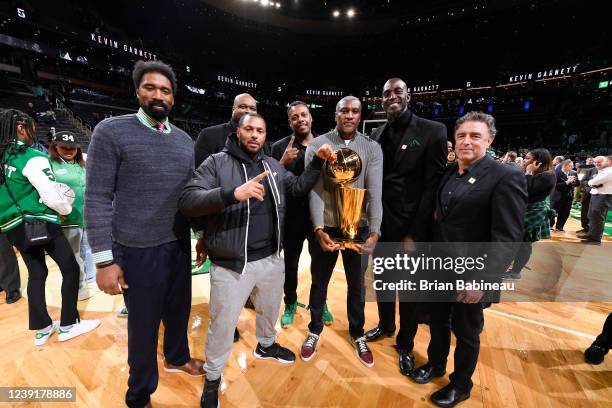 Former Boston Celtics Players, Leon Powe, Eddie House, Antoine Walker, Paul Pierce, James Posey, Kevin Garnett and Wycliffe Grousbeck pose for a...