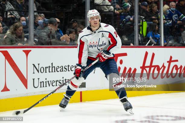 Washington Capitals defenseman John Carlson skates with the puck during their NHL game against the Vancouver Canucks at Rogers Arena on March 11,...