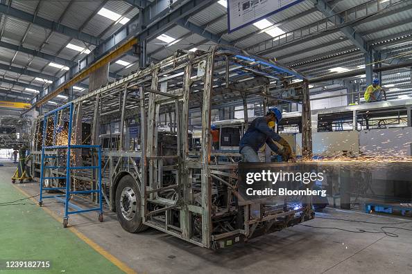 Bus Stack Assembly Workers weld parts to make the frame of a bus at the cubing assembly ...