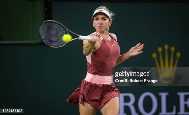 Simona Halep of Romania hits a forehand against Cori Gauff of the United States her third-round match at the Indian Wells Tennis Garden on March 13,...