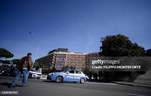 Police patrol outside the entrance of the Cavalieri Waldfor Astoria hotel in Rome on March 14, 2022 where US president's national security adviser,...