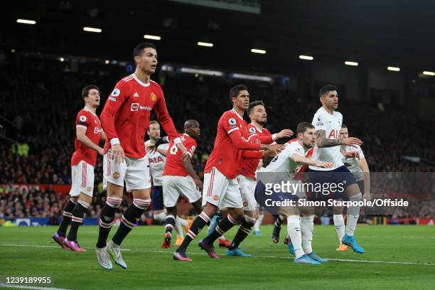 Ben Davies of Tottenham Hotspur backs into Raphael Varane of Manchester United as a corner comes in during the Premier League match between...