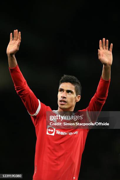 Raphael Varane of Manchester United waves after the Premier League match between Manchester United and Tottenham Hotspur at Old Trafford on March 12,...