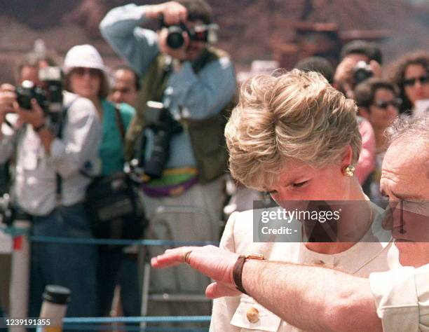 Photo dated 23 April 1994 showing Princess Diana arriving in Rio de Janeiro under the cameras of photographers during an official trip in Brazil. -...