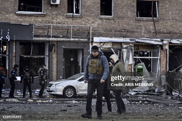 Kyiv's mayor Vitali Klitschko walks in front of a destroyed apartment building, in Kyiv on March 14 as various neighbourhoods of the Ukraine capital...