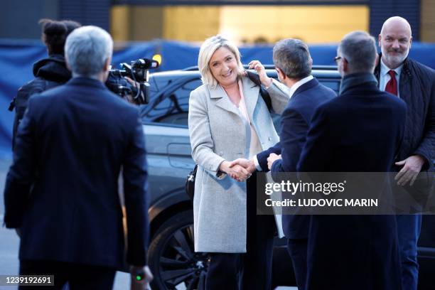 France's far-right party Rassemblement National candidate for the 2022 French presidential election Marine Le Pen, flanked by her bodyguard Thierry...