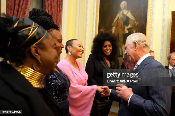 Prince Charles, Prince of Wales shakes hands with British singer-songwriter Emeli Sandé at the annual Commonwealth Day Reception which traditionally...