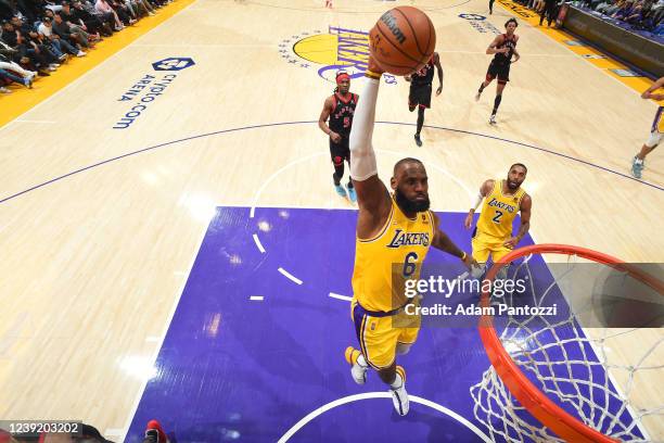 LeBron James of the Los Angeles Lakers dunks the ball during the game against the Toronto Raptors on March 14, 2022 at Crypto.Com Arena in Los...