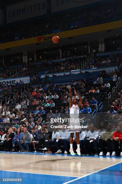Theo Maledon of the Oklahoma City Thunder shoots a three point basket during the game against the Charlotte Hornets on March 14, 2022 at Paycom Arena...