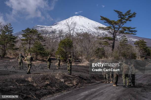 Members of the Japanese Ground Self-Defense Force gather near Mount Fuji as they wait to observe a joint exercise with Japans 1st Amphibious Rapid...