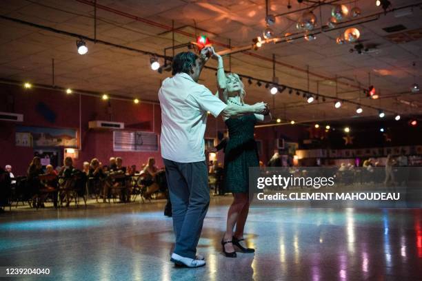 Elderly people dance on a thursday afternoon at the "Roaljorero dancing" in Monteux, southeastern France on March 3, 2022. - This nightclub, is one...