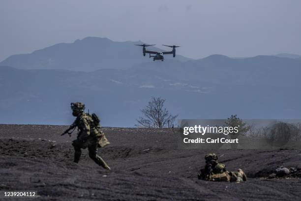 United States Marine Corp Osprey comes in to land next to soldiers from Japans 1st Amphibious Rapid Deployment Brigade during an exercise with the...