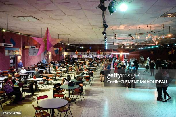 Elderly people dance on a thursday afternoon at the "Roaljorero dancing" in Monteux, southeastern France on March 3, 2022. - This nightclub, is one...