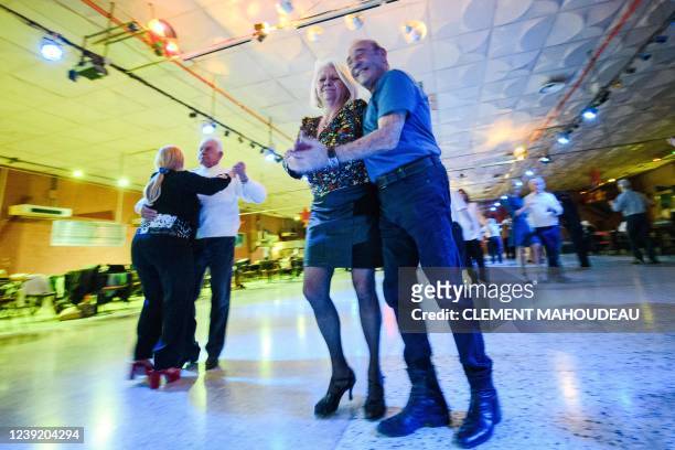 Elderly people dance on a thursday afternoon at the "Roaljorero dancing" in Monteux, southeastern France on March 3, 2022. - This nightclub, is one...