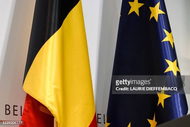 Illustration picture shows the Belgian flag and the European flag at a press conference of the Federal Government regarding the measures taken to...