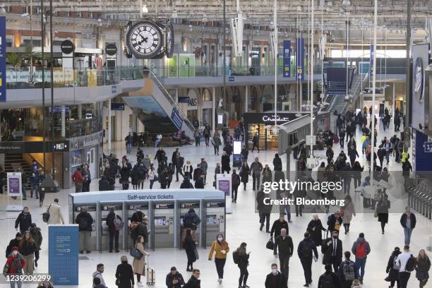 Commuters make their way through a railway concourse after arriving at London Waterloo railway station, in London, U.K. On Monday, March 14, 2022....