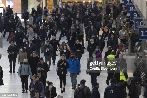 Commuters make their way along a railway concourse after arriving at London Waterloo railway station, in London, U.K. On Monday, March 14, 2022. U.K....