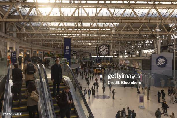 Commuters walk through a railway concourse after arriving at London Waterloo railway station, in London, U.K. On Monday, March 14, 2022. U.K....