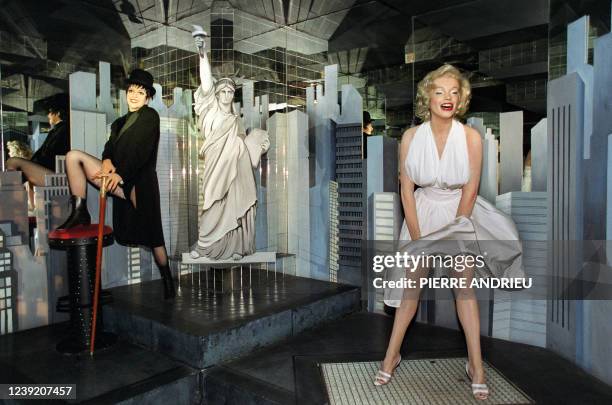 The wax models of American actresses Marilyn Monroe and Liza Minelli are exhibited, November 14, 2000 in Paris, in a room of the Grevin museum. The...