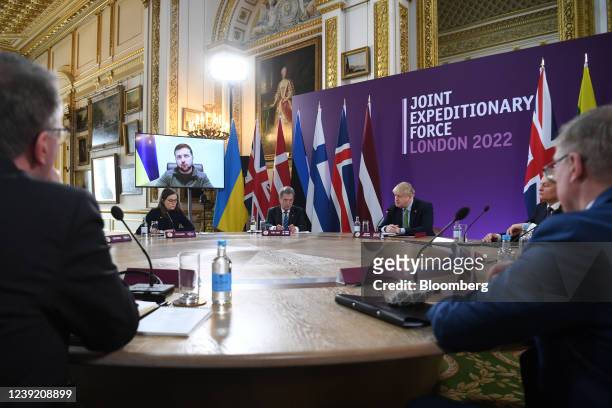 Volodymyr Zelenskiy, Ukraine's president, addresses via video link, attendees including Katrin Jakobsdottir, Iceland's prime minister, left, Sauli...